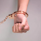 NAUGHTY TOYS Gold pladed heavy handcuffs with pink fur